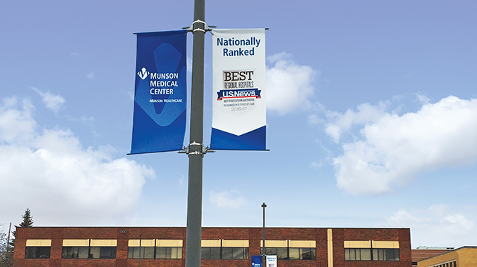 BannerSaver spring-loaded banner brackets and custom banners outside of a hospital.