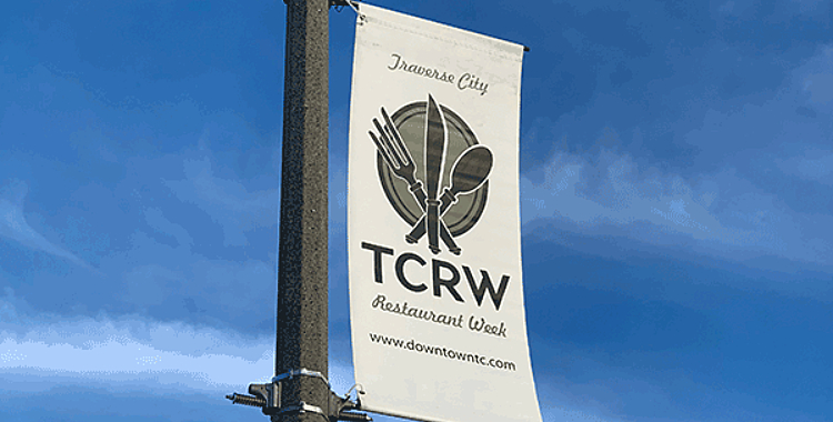 Light pole banner and brackets that says TC Restaurant Week