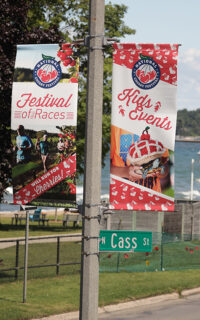 BannerSaver brackets and custom light pole banners advertising the National Cherry Festival in Traverse City, Michigan.