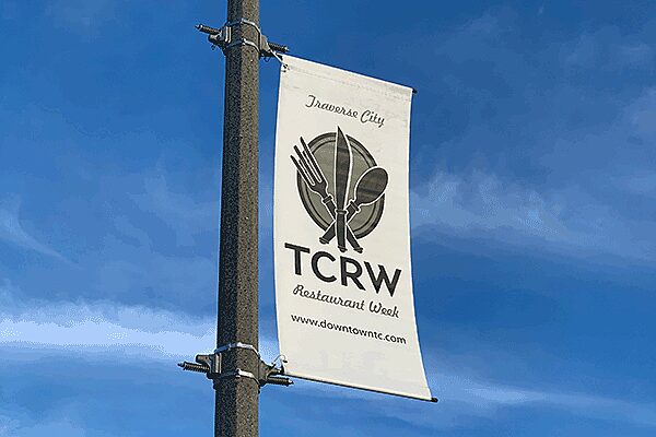 Light pole banner and brackets that says TC Restaurant Week