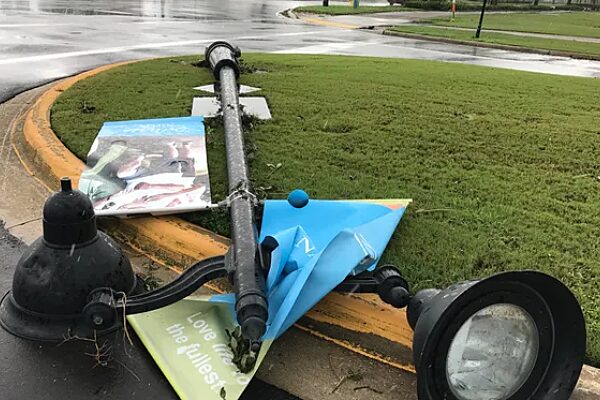 Fallen light pole with broken static banner brackets