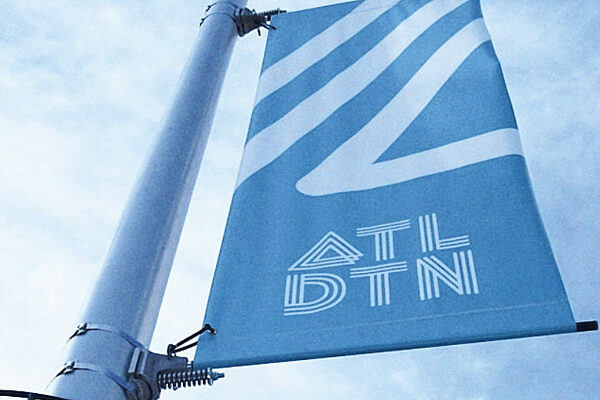 Downtown Atlanta banner on a light pole with bannersaver bracket