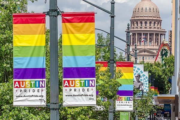 Banner Saver brackets holding custom banners on Austin, Texas streetlights.