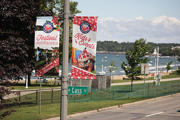 BannerSaver brackets and custom light pole banners advertising the National Cherry Festival in Traverse City, Michigan.